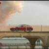 A car speeds along the bridge, where it will crash into one of the buildings    © Mirage Entertainment